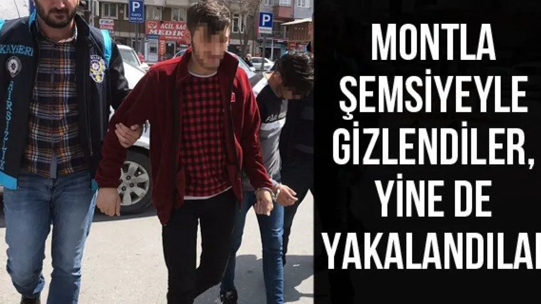 Montla şemsiyeyle gizlendiler, yine de yakalandılar