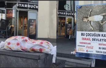 Kayseri'de Starbucks önünde Vicdan Nöbeti: Kapısına kanlı çocuk kefeni maketi bırakıldı