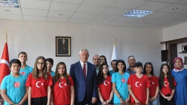 'Bizim Türkümüz' heyeti Müdür Elmalı'yı ziyaret etti