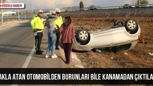 Takla atan otomobilden burunları bile kanamadan çıktılar