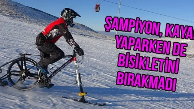 Şampiyon, kayak yaparken de bisikletini bırakmadı