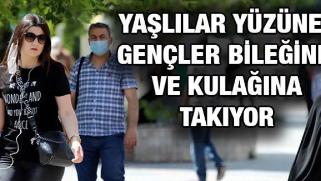 Yaşlılar yüzüne gençler bileğine ve kulağına takıyor