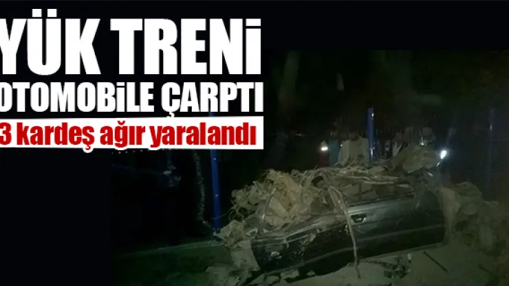 YÜK TRENi OTOMOBiLE ÇARPTI
