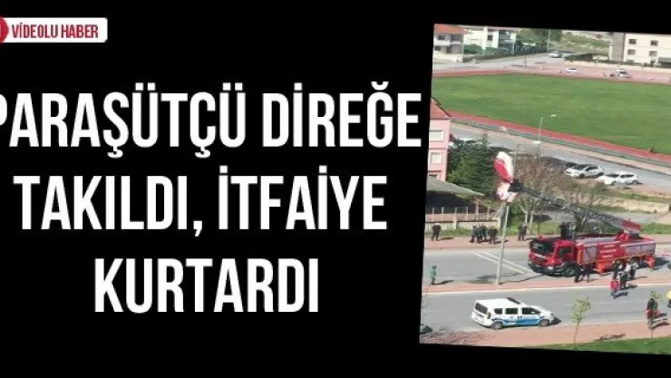 Paraşütçü direğe takıldı, itfaiye kurtardı
