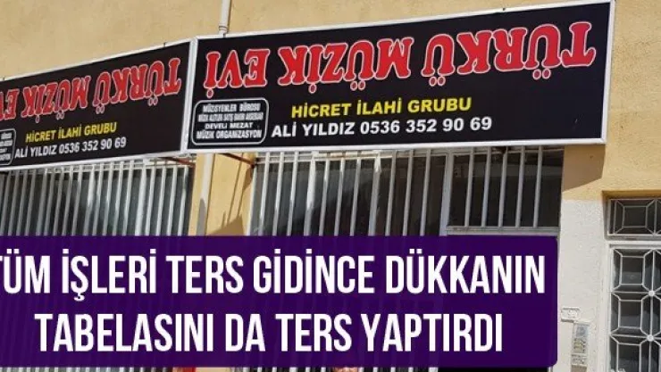 Tüm işleri ters gidince dükkanın tabelasını da ters yaptırdı
