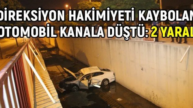 Direksiyon hakimiyeti kaybolan otomobil kanala düştü: 2 yaralı